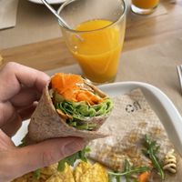 Tofu veggie wrap with fresh local orange juice   at Alfarroba Cafe in Albufeira