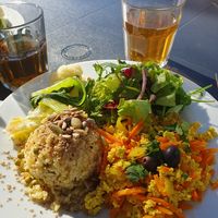Tofu scramble,  grains, veggies,  salad with chilli sauce at Alfarroba Cafe in Albufeira