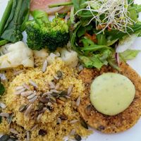 tempeh burger but without the bun and instead as a side of the main dish at Alfarroba Cafe in Albufeira