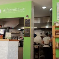 Kitchen and counter area with small organic shop at Alfarroba Cafe in Albufeira