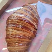 Giant croissant at Hey Plant Bae in Edinburgh