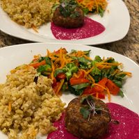 Beet Hummus plate with sundries tomato cake and golden rice.  We split a lot of the meals into two lunches!  This is one meal split.  at Sprinly in Cleveland