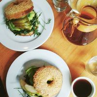 vegan bagel, avocado, basil pesto, pear at Kawiarnia Stragan in Poznan