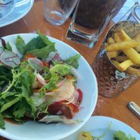 Starter salad & crispy fries! at Restaurang Sand in Bastad