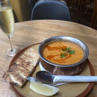 Tomato and lentil soup with bread   at Mezze Bar in Auckland