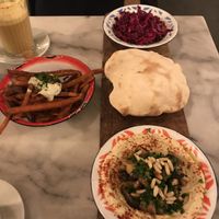 Hummus with eggplants, pita and veggies at Hummus in Delft