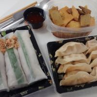 Seitan curry, veggie gyozas, thai summer rolls  at Nan-yea Market in Madrid