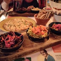 Tapas bowls: mezze grain bowl, edamame bowl, black beans & sweetcorn, with garlic flatbread and sweet potato fries at Lounges - Nautico Lounge in Weymouth