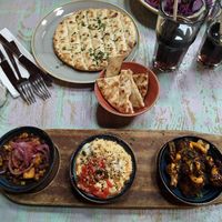 Garlic flat bread + Tapas board: bang bang cauliflower, humous and beans at Lounges - Nautico Lounge in Weymouth