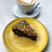 Torta de arequipe y chocolate y capuchino en leche de coco. at Cardamomo in Bogota
