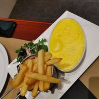 Slices of smoked tofu and bread with vegan cheese at Le London in Calais