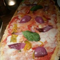 Vegan rustica Margherita pizza with added onions, peppers and garlic at Zizzi - Charlotte St in London