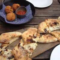 Garlic bread with cheese, and arancini at Zizzi - Paddington Central in London