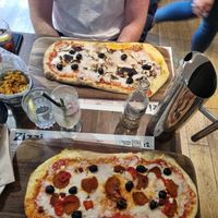 Vegan mozzarella pizza with olives and mushrooms & vegan spicy jackfruit pizza at Zizzi in St Andrews
