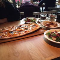 Vegan rustica pizza with butternut squash, Caramelised balsamic onions, mushrooms, garlic cloves and pine nuts  at Zizzi in Watford