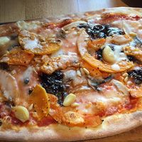 Vegan rustica pizza with butternut squash, Caramelised balsamic onions, mushrooms, garlic cloves and pine nuts  at Zizzi in Watford