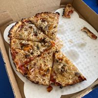 Pizza with non-dairy marinara, vegan cheese, mushrooms, bell peppers, and onions  at Silver Beach Pizza in St Joseph