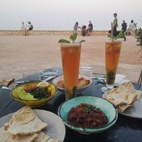 Flatbread with Moussaka, Herbsalad, spinach pastries, iced tea -all vegan- at Le Phenicia in Antibes