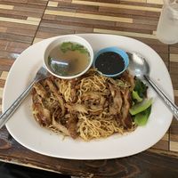 Vegan duck with yellow noodles. The two sauces are a spicy soy and a mildly spicy stock.  at Jai Mai Jumjay in Chiang Mai