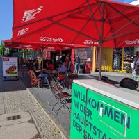 Outdoor seating at Curry at the Wall - Food Stand in Berlin