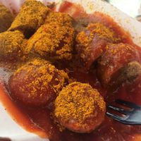 Vegan sausage with a Tomato sauce and spices  at Curry at the Wall - Food Stand in Berlin
