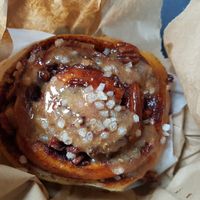 Sticky cinnamon bun bought to takeaway at Chesters by the River in Skelwith Bridge
