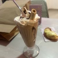Vegan chocolate milkshake! And half a doughnut, because why wait 🙋🏻‍♀️  at Frambuesa Pastelería Vegan in Bogota