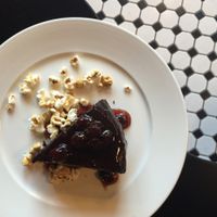rich and dense chocolate cake with cherry sauce and caramels corn!  at Liberty Food & Wine Exchange in Reno