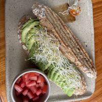 Avocado sandwich with extra portion of tomatoes  at La Bodega Verde in Lima