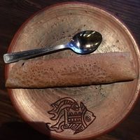 Sweet rice pancake that’s labelled vegan. It is extremely good and very filling. at Jatra Biroti in Dhaka