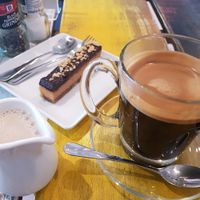 Black Coffee, Almond Milk and Crunchbox Peanut Butter Bar at Wilson's in Phuket