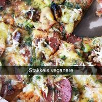 Mathias with vegan cheese and vegan pepperoni  at Bella Sydhavn Pizzeria in Copenhagen