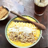 Banana mango smoothie bowl & iced coffee  at Rosie's Cafe in Hoi An