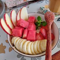 Warm oatmeal with coconut milk and cinnamon, topped with fruit at Rosie's Cafe in Hoi An
