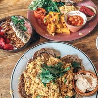 Tofu scramble with quinoa, greens and beans, banana strawberry peanut smoothie bowl at Rosie's Cafe in Hoi An