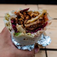 Vegan Döner 
Freshly Made Bread, Spiced Soya Pieces, Mixed Salad, Tzatziki (Soya yogurt), Homemade Hummus and Chilli Sauce.  at What The Pitta in London