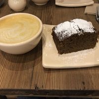 Turmeric latte (or should I say bowl!) and carrot cake. Divine! at Le Pain Quotidien - Vicente Lopez in Buenos Aires