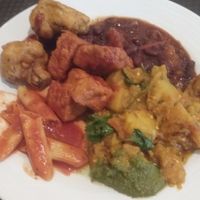 Lunch buffet plate (vegan): BBQ tofu, pasta, aloo baingan, cauliflower pakora at Govinda's in Houston