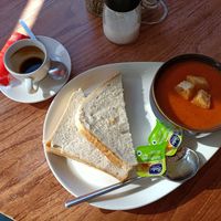 Soup served with bread and vegan butter. at Wal Restauraunt in Caernarfon