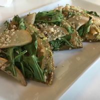 Arugula pear caramelized onion pizza at Living Kitchen in Raleigh