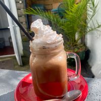 Iced oat mocha with cream and chocolate powder!  at The Cornish Vegan in Truro