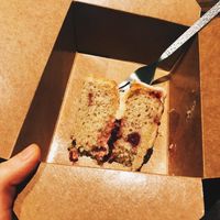 The beautiful lemon and raspberry cake in the takeaway box. at The Cornish Vegan in Truro