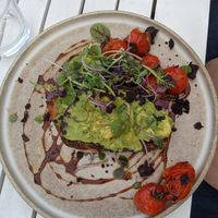 Roasted tomatoes with olive toast, avocado instead of eggs at Queenscliff General Store Cafe in Queenscliff