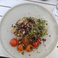 Avocado on toast with roasted tomatoes and hummus at Queenscliff General Store Cafe in Queenscliff