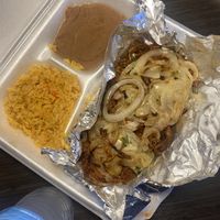 Birria tacos under there  at El Palote Panaderia in Dallas