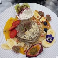 Buckwheat pancakes with Cocowhip and maple syrup and fruit.  at Mr Black Juicery in Berwick