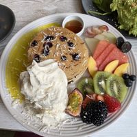 Buckwheat pancakes, lots of coconut ice cream, the pancakes were a little dry though. Lemon curd was delicious!  at Mr Black Juicery in Berwick