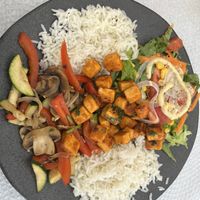 Portuguese style tofu, sautéed vegetables, rice and salad  at Ateliê 47 in Silves