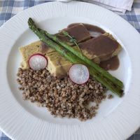 chickpea cakes in wine sauce with buckwheat and asparagus  at VeganFresh Hotel & Restaurant in Medvode