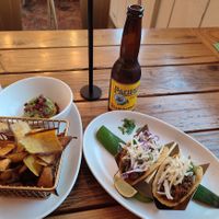 Cali & Baja tacos with vegan picadillo, side order of plantain chips with guac at Tocaya Modern Mexican in Venice